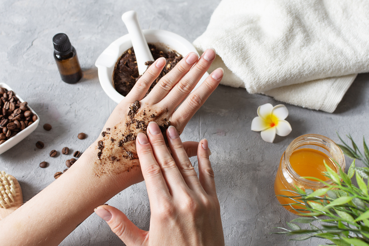 Woman's Hands Applying Homemade Body Scrub Flatlay 